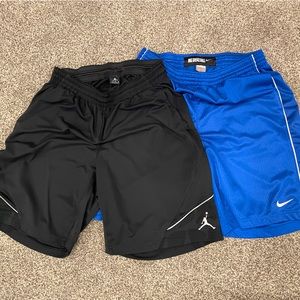 One pair of Black Jordan Shorts; One pair of Blue Nike Shorts